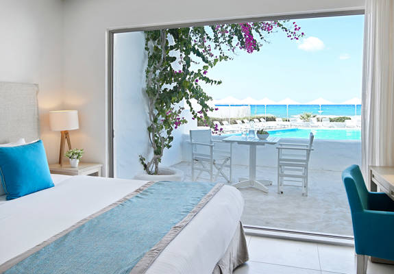 Knossos Beach Two Bedroom Suite Sea View double bed and terrace view