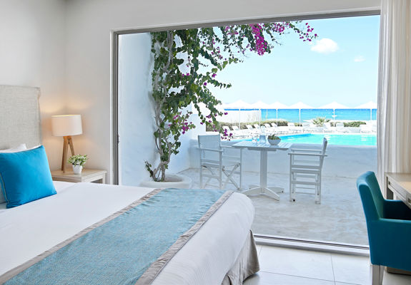 Knossos Beach Two Bedroom Suite Sea View double bed and terrace view