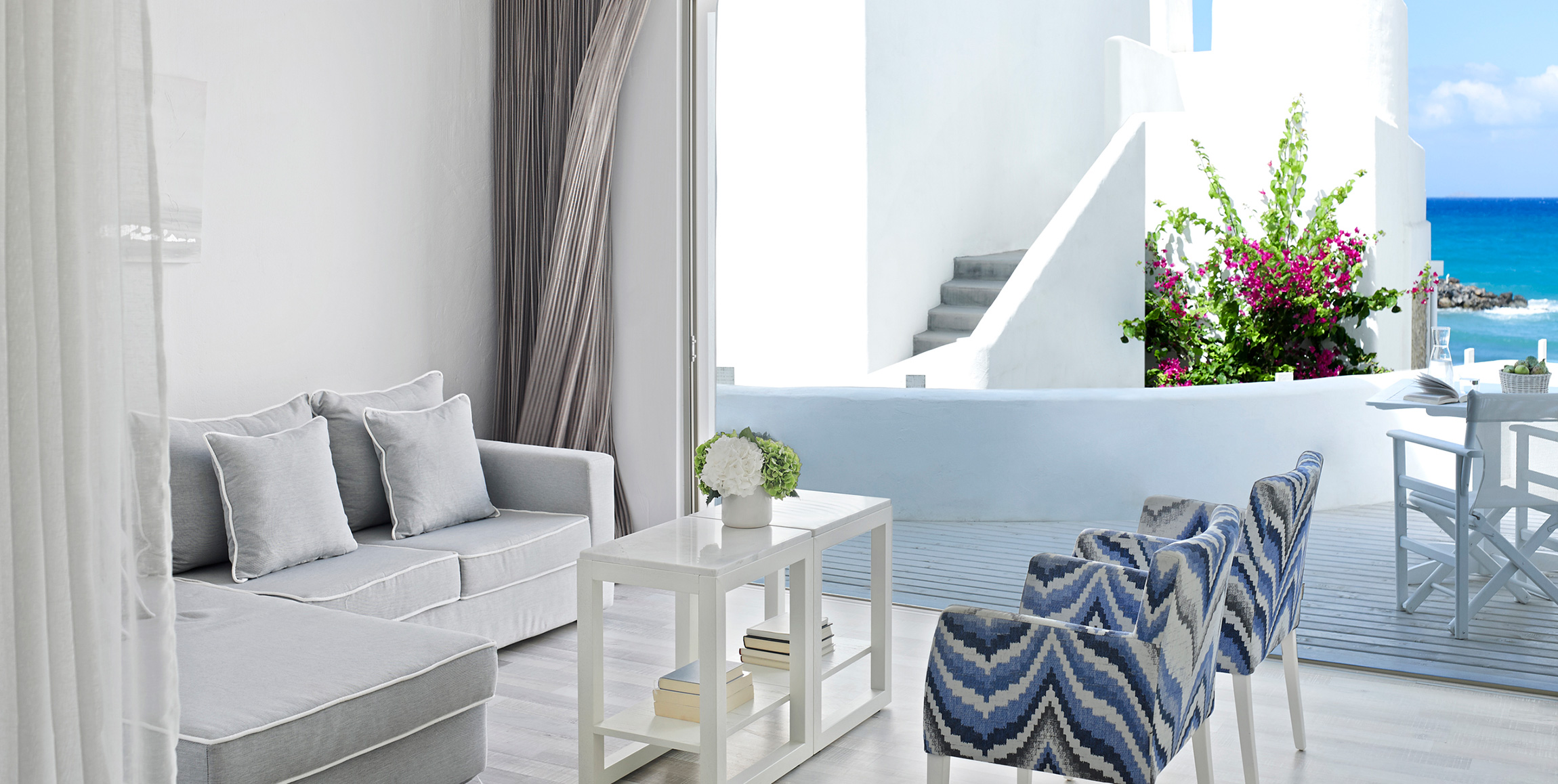 Knossos Beach Two Bedroom Suite Sea View couch, armchairs, table and terrace view
